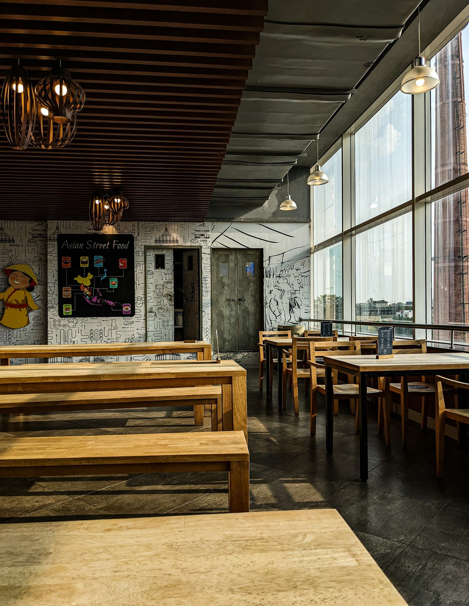 Warm café interior with long wooden benches